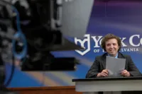 A Mass Communication student practicing in the live studio 