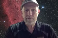 Professor Drew Wilkerson with space-like background 