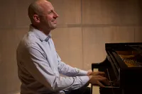 Dr. Oswoski playing the piano 