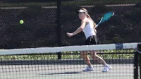Oestermarker playing tennis. 