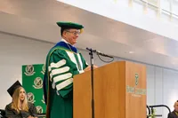 Dr. Burns speaking at Commencement. 