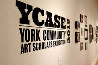 YCASE logo on the wall of the exhibit