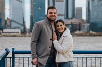 Alumni couple engaged in a large city