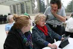 Behavioral Sciences chair Mary Ligon,a  gerontologist, works with seniors and York students on an iPad project.