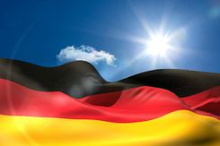 Stock photo of german flag flying on a sunny day.