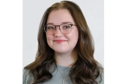 A student posing for her headshot 