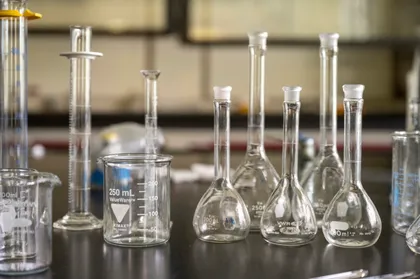 Chemistry beakers on a lab table. 