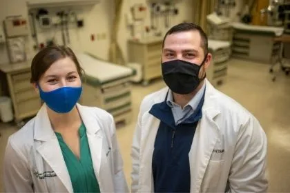 Two Nurse Anesthetist students posing in a Diehl Hall lab 