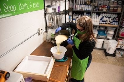 A Chemistry student making soap for her own company