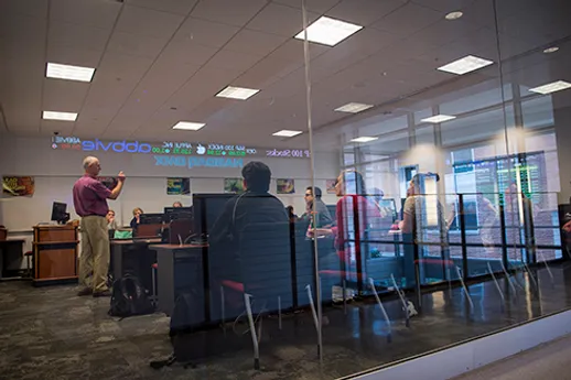 A glimpse into the glass-encased NASDAQ Trading Lab at York College.